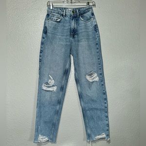 The brand is Zara, size 2. They are mom jeans. The wash is a mid blue color.
